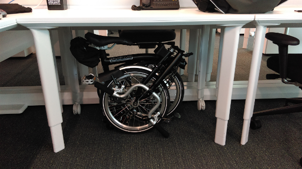 Folding bicycle under a desk